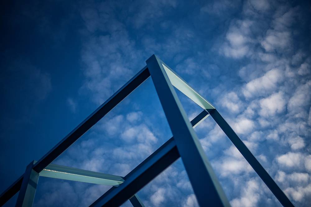 Looking up at blue sky and art sculpture at GVSU